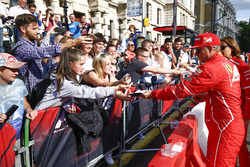 Kimi Raikkonen, Ferrari, signs autographs for fans