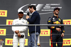 Podium: Mark Webber, Channel 4 F1, interviews race winner Lewis Hamilton, Mercedes AMG F1