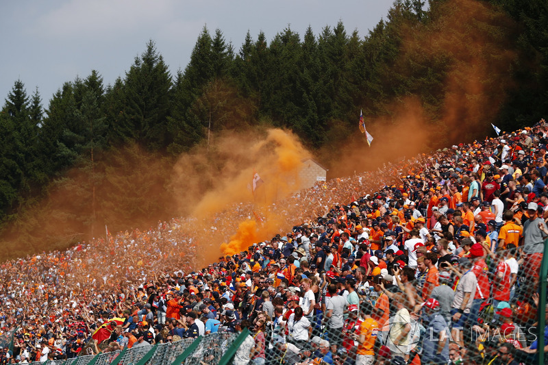 A large Dutch of fans contingent set off orange flares