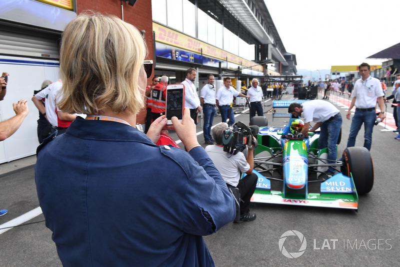 Sabine Kehm, takes a photo of Mick Schumacher, Benetton B194