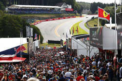 Fans between merchandising stands at the bottom of Eau Rouge