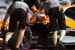Fernando Alonso, McLaren MCL32, is returned to the garage