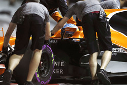 Fernando Alonso, McLaren MCL32, is returned to the garage
