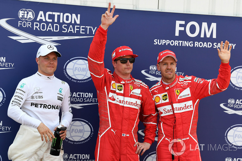 Ganador de la pole Kimi Raikkonen, Ferrari, segundo Sebastian Vettel, Ferrari y tercero Valtteri Bottas, Mercedes AMG F1