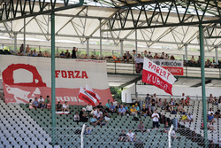 Fans of Robert Kubica, Renault Sport F1 Team, wait in the grandstand