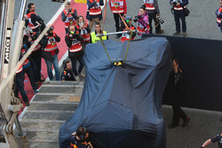 The Red Bull Racing RB13 of Daniel Ricciardo back to the pits