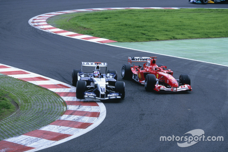 Juan Pablo Montoya, Williams overtakes Michael Schumacher, Ferrari at Bus stop