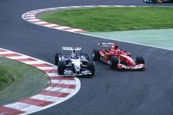 Juan Pablo Montoya, Williams overtakes Michael Schumacher, Ferrari at Bus stop