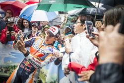 Marc Marquez, Repsol Honda poses for selfies with his fans during the MotoGP parade