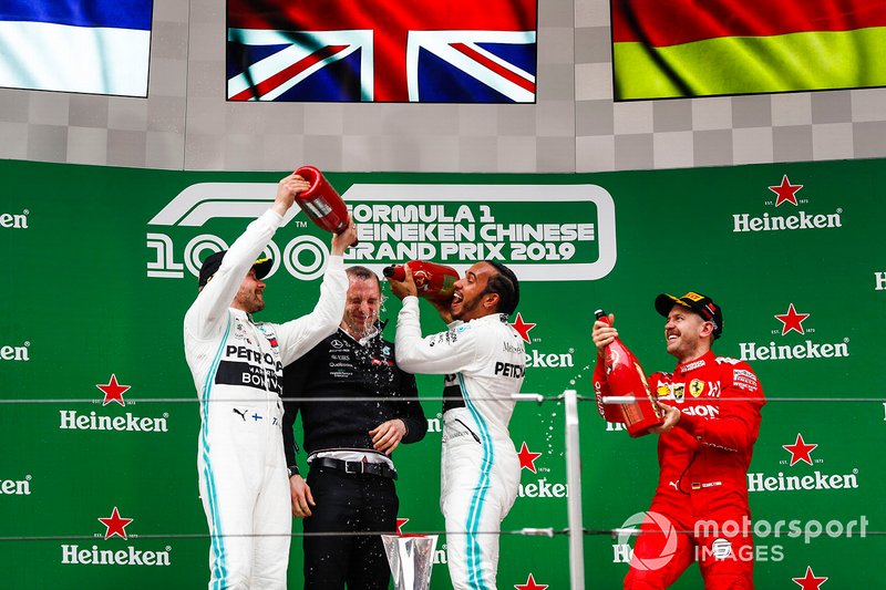 Valtteri Bottas, Mercedes AMG F1, 2nd position, Lewis Hamilton, Mercedes AMG F1, 1st position, and Sebastian Vettel, Ferrari, 3rd position, on the podium