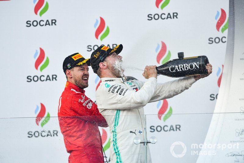Valtteri Bottas, Mercedes AMG F1, 1st position, blasts himself with Champagne on the podium