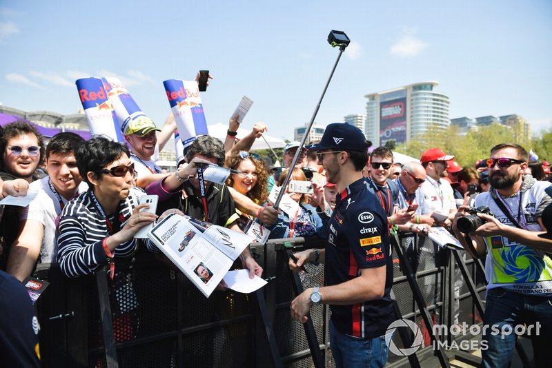 Pierre Gasly, Red Bull Racing signs an autograph for a fan