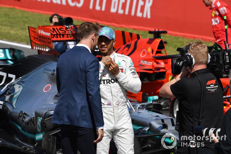 Lewis Hamilton, Mercedes AMG F1, is interviewed by Jenson Button, Sky Sports F1, after Qualifying