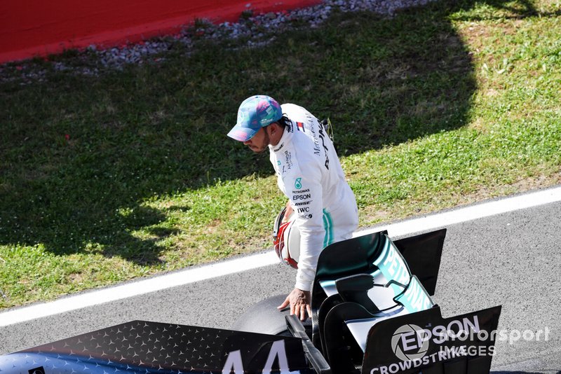 Lewis Hamilton, Mercedes AMG F1, inspects his car after Qualifying