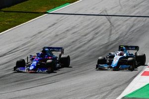 Daniil Kvyat, Toro Rosso STR14,leads Robert Kubica, Williams FW42