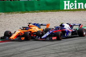 Fernando Alonso, McLaren MCL33, and Pierre Gasly, Toro Rosso STR13, go wheel-to-wheel