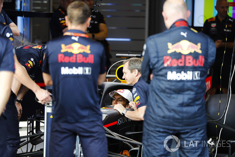 Pierre Gasly, Toro Rosso, sits in a Red Bull Racing RB14