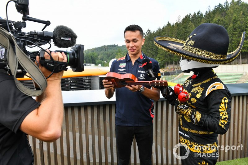 Alexander Albon, Red Bull, is presented with a musical instrument