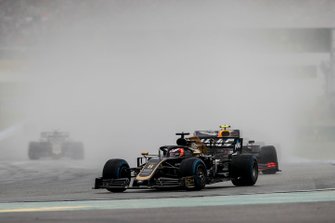 Romain Grosjean, Haas F1 Team VF-19, leads Pierre Gasly, Red Bull Racing RB15