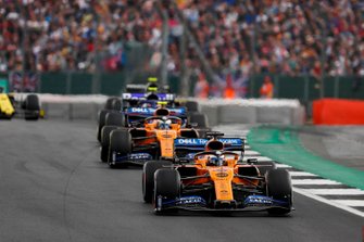 Carlos Sainz Jr., McLaren MCL34, leads Lando Norris, McLaren MCL34, and Alexander Albon, Toro Rosso STR14