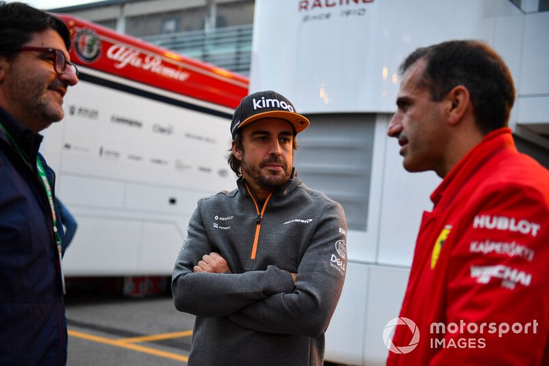 Fernando Alonso, McLaren, with Marc Gene, Ferrari