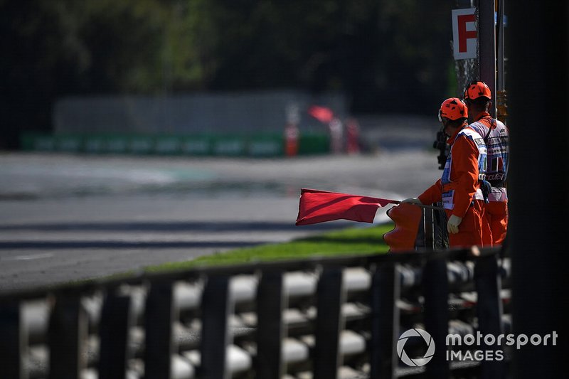 Marshals wave a red flag