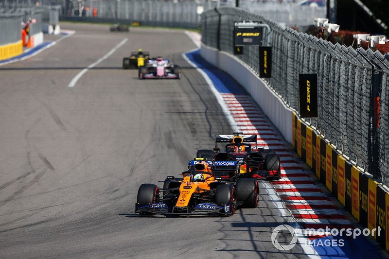Lando Norris, McLaren MCL34, leads Max Verstappen, Red Bull Racing RB15