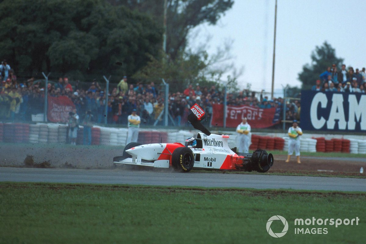 Mika Hakkinen, Mclaren MP4-10 spins off after collision with Eddie Irvine