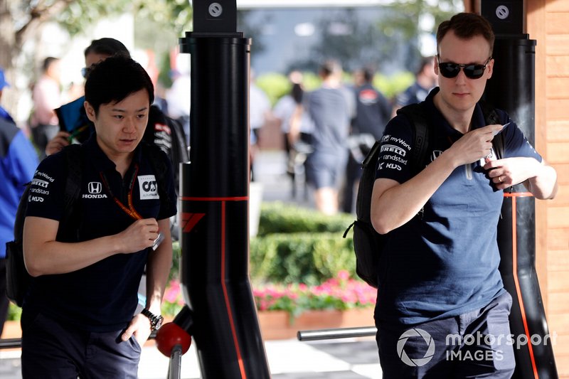 AlphaTauri personnel arrive at the track