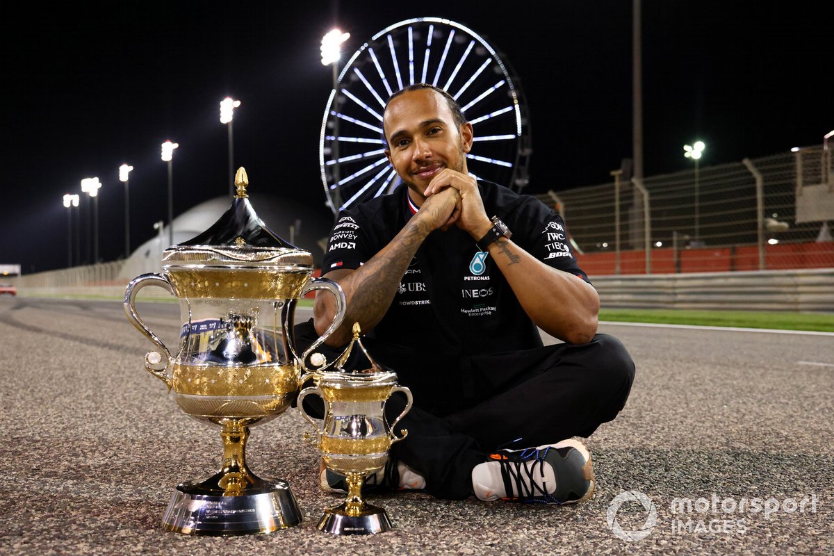 Lewis Hamilton, Mercedes, 1st position, with the trophies