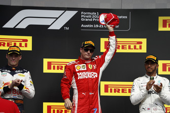 Max Verstappen, Red Bull Racing, 2nd position, and Lewis Hamilton, Mercedes AMG F1, 3rd position, applaud as Kimi Raikkonen, Ferrari, 1st position, celebrates victory