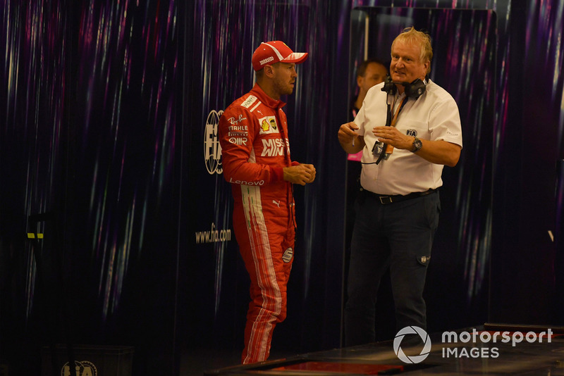 Sebastian Vettel, Ferrari and Jo Bauer, FIA Technical Delegate in Parc Ferme