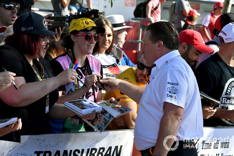 Zak Brown, Executive Director, McLaren signs autographs for fans.