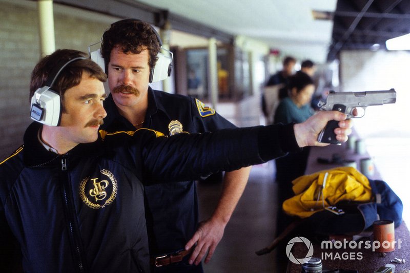 Nigel Mansell, Lotus practices shooting with the local Police