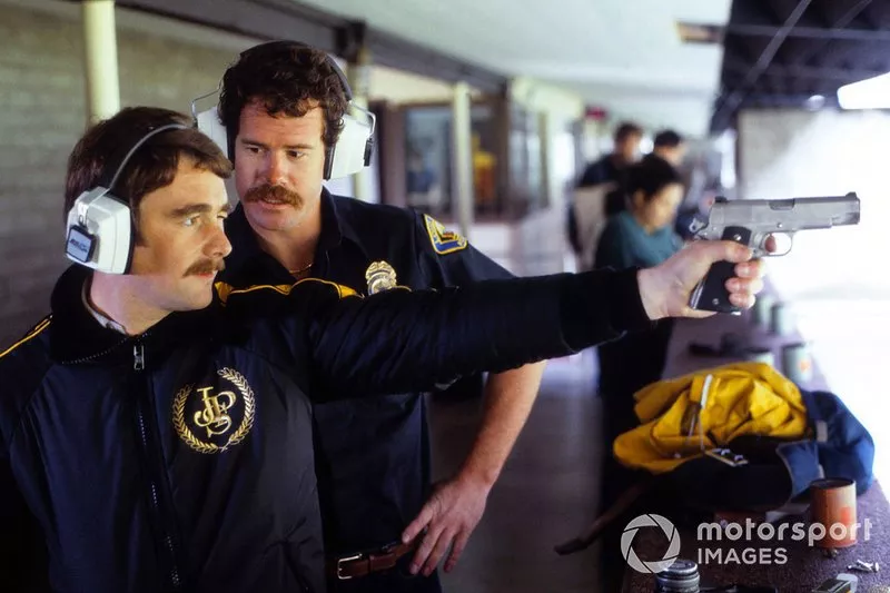 Nigel Mansell, Lotus practices shooting with the local Police