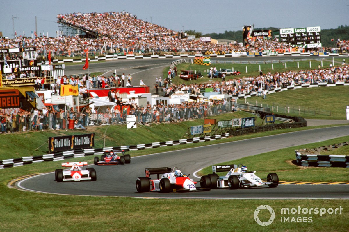 Keke Rosberg, Williams FW08C Ford, leads Mauro Baldi, Alfa Romeo 183T, Niki Lauda, McLaren MP4-1C Ford, and Bruno Giacomelli, Toleman TG183B Hart