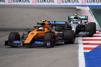 Lando Norris, McLaren MCL34, leads Valtteri Bottas, Mercedes AMG W10