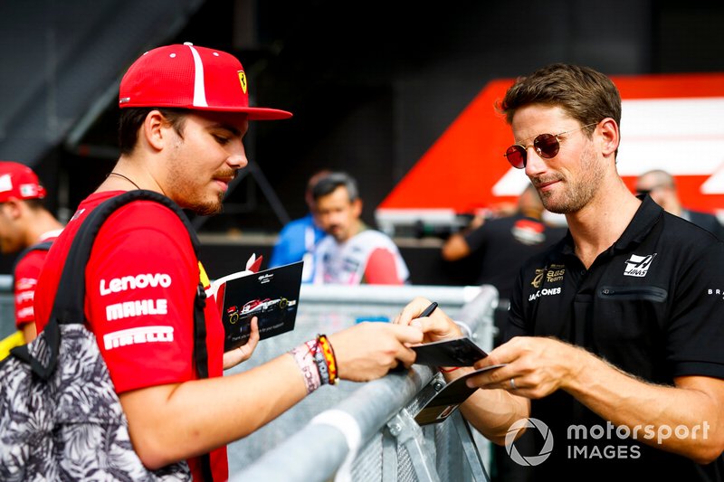 Romain Grosjean, Haas F1 signs an autograph for a fan