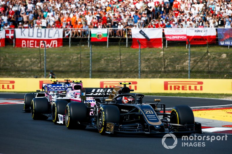 Kevin Magnussen, Haas F1 Team VF-19, leads Lance Stroll, Racing Point RP19, and Antonio Giovinazzi, Alfa Romeo Racing C38