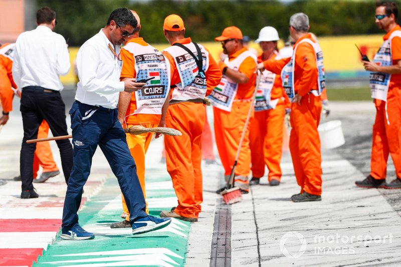 Michael Masi, Race Director inspects oil spill from the F2 race