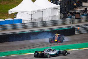 Lewis Hamilton, Mercedes AMG F1 W09, passes a spinning Max Verstappen, Red Bull Racing RB14 Tag Heuer, after the latter suffers a collision with Esteban Ocon, Force India VJM11 Mercedes. 