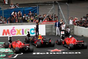 Max Verstappen, Red Bull Racing RB14, celebrates winning the race in parc ferme with Sebastian Vettel, Ferrari SF71H, and Kimi Raikkonen, Ferrari SF71H