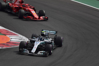 Valtteri Bottas, Mercedes AMG F1 W09 EQ Power+ and Kimi Raikkonen, Ferrari SF71H