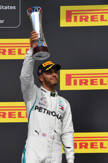 Lewis Hamilton, Mercedes AMG F1 celebrates on the podium on the podium with the trophy