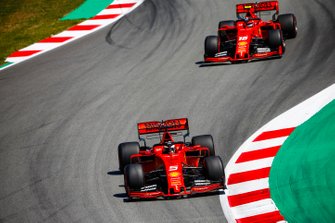 Sebastian Vettel, Ferrari SF90, leads Charles Leclerc, Ferrari SF90