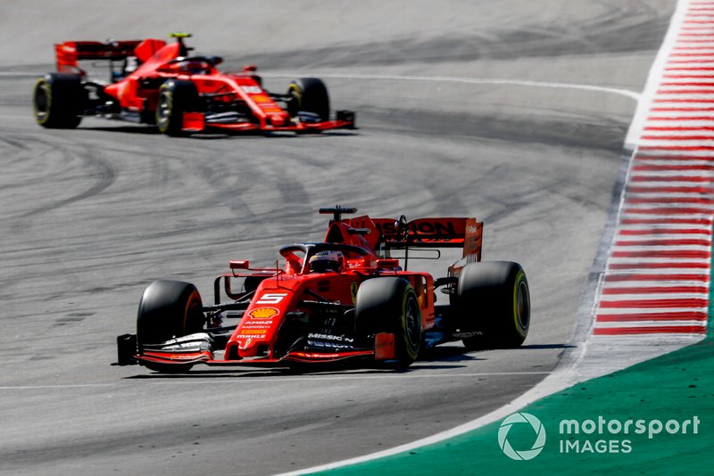 Sebastian Vettel, Ferrari SF90, leads Charles Leclerc, Ferrari SF90