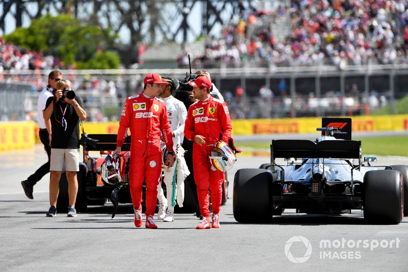 Charles Leclerc, Ferrari, talks with pole man Sebastian Vettel, Ferrari, after Qualifying