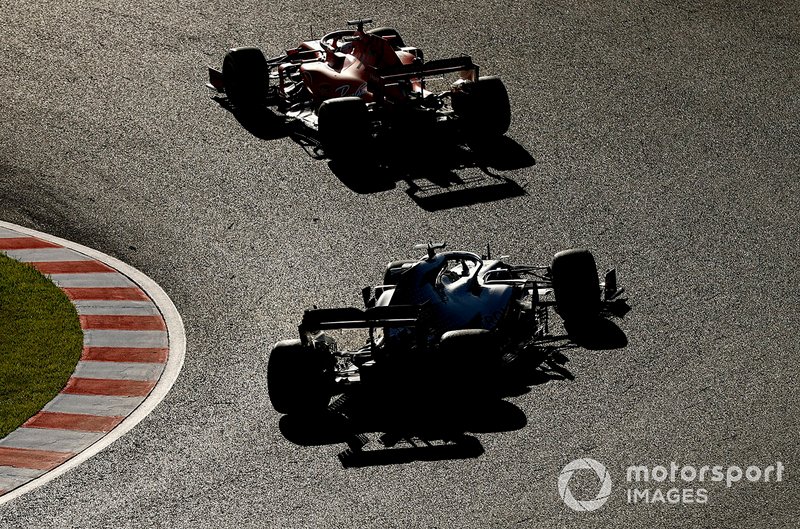 Sebastian Vettel, Ferrari SF90, leads Lewis Hamilton, Mercedes AMG F1 W10