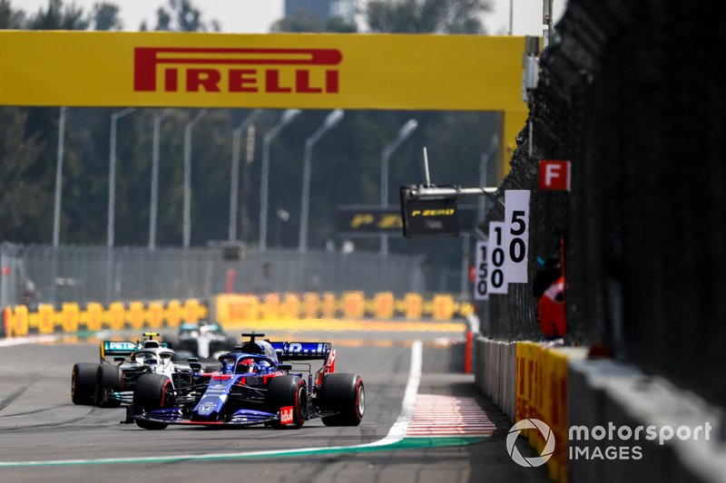 Daniil Kvyat, Toro Rosso STR14, leads Valtteri Bottas, Mercedes AMG W10