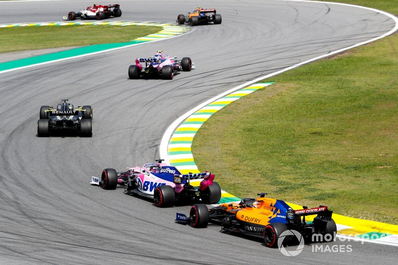 Lance Stroll, Racing Point RP19, leads Daniel Ricciardo, Renault F1 Team R.S.19, Sergio Perez, Racing Point RP19, and Carlos Sainz Jr., McLaren MCL34